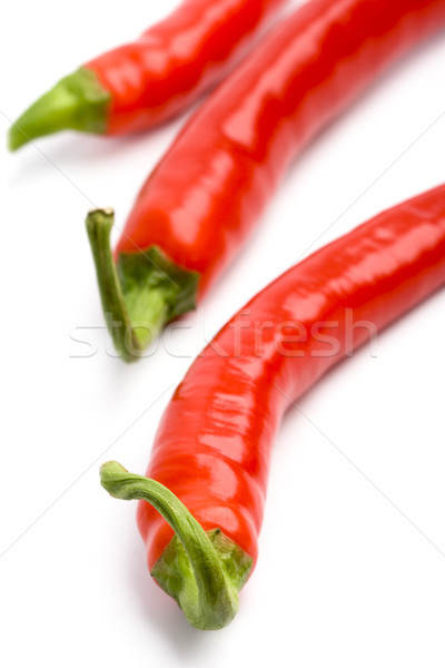 Drei rot Chilischoten weiß Essen Stock foto © marylooo
