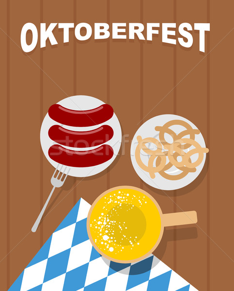 Beer mug on a wooden table and sausages in plate. Beer snack pre Stock photo © MaryValery