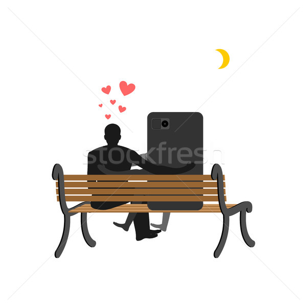 Lover of gadgets. Man and smartphone Sitting on bench. Always to Stock photo © MaryValery