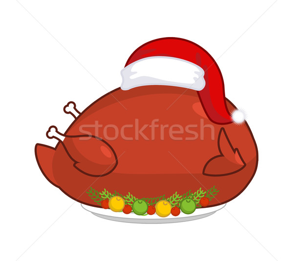 Big Roast turkey in Santa Claus cap. Christmas fowl on plate wit Stock photo © MaryValery
