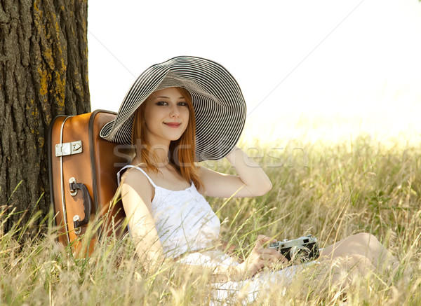 Vörös hajú nő lány ül fa régi fényképezőgép fű Stock fotó © Massonforstock