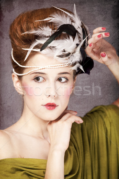 Redhead girl with Rococo hair style at vintage background. Photo Stock photo © Massonforstock
