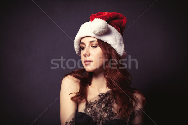 Woman in Santa Claus hat  Stock photo © Massonforstock