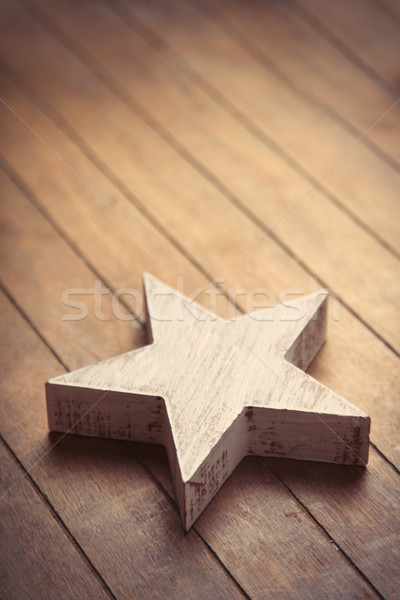 beautiful star shaped toy lying on the wonderful brown wooden ba Stock photo © Massonforstock