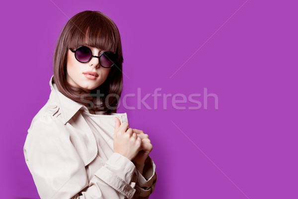 photo of beautiful young woman on the wonderful purple grey back Stock photo © Massonforstock