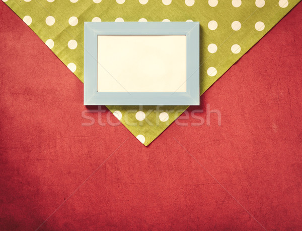 Photo frame and polka dot napkin Stock photo © Massonforstock