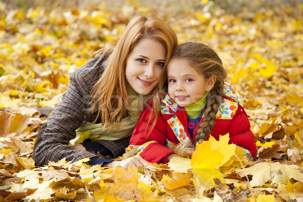 Mother and daughter in autumn yellow park Stock photo © Massonforstock