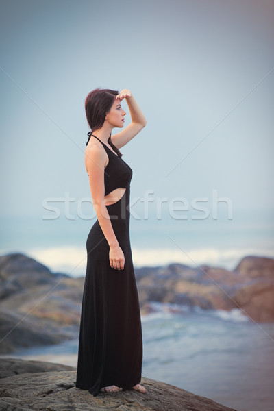 beautiful young woman standing on the stone coast in sunny Sri L Stock photo © Massonforstock