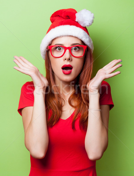 Meglepődött nők karácsony kalap portré szürke Stock fotó © Massonforstock