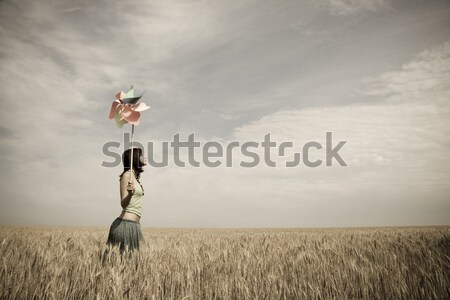 redhead girl in black dress on meadow.  Stock photo © Massonforstock