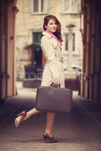 Stock photo: portrait of a beautiful girl on the street.  Photo in vintage st