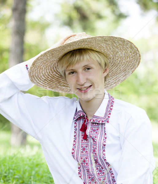 Young slav teen at green meadow in national clothing. Stock photo © Massonforstock