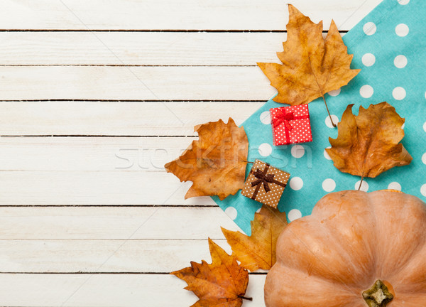 Pumpkin and leafs with gifts Stock photo © Massonforstock