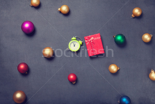 Stock photo: Gift and alarm clock with baubles 