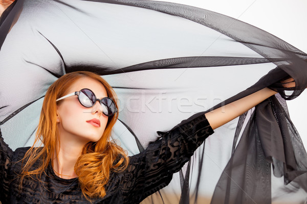 photo of beautiful young woman holding shawl on the wonderful  s Stock photo © Massonforstock