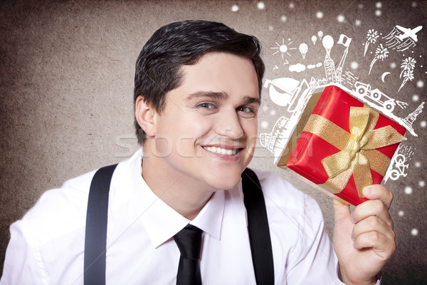 American businessman with magical travel gift. Stock photo © Massonforstock