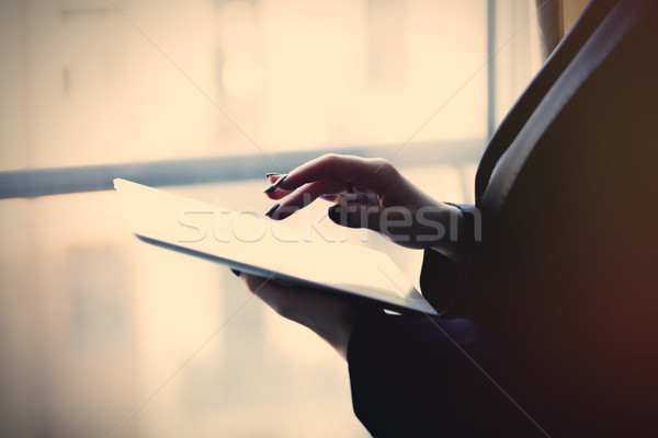 young caucasian female hands holding a tablet and typing text ne Stock photo © Massonforstock