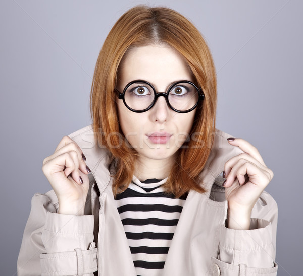 Young red-haired girl in glasses and cloak. Stock photo © Massonforstock