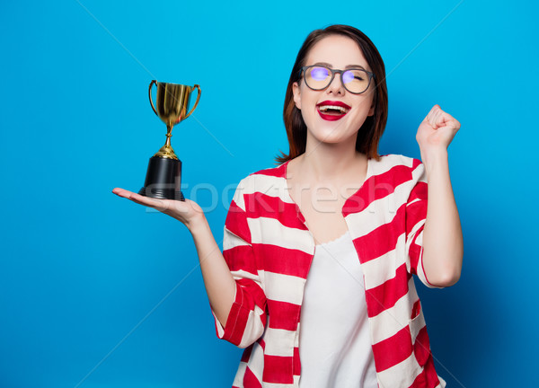 young smiling woman with cup trophy Stock photo © Massonforstock