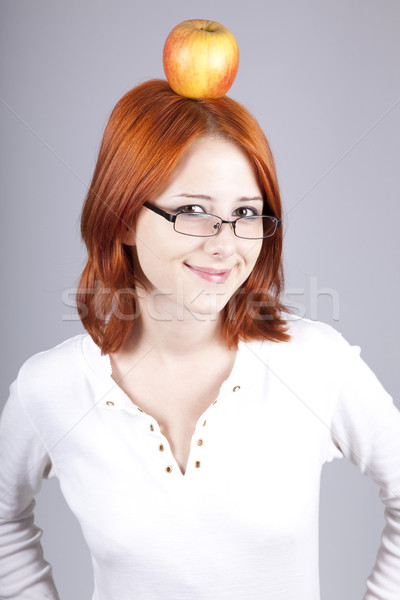 Red Haired Girl Keep Apple On Her Head Stock Photo C Volodymyr