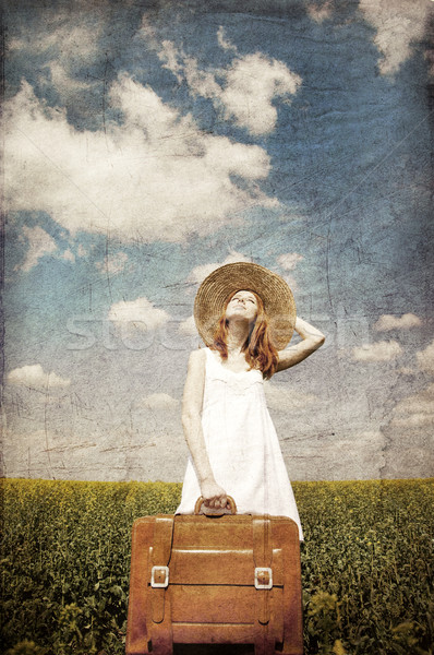 Lonely girl with suitcase at country. Stock photo © Massonforstock