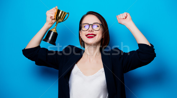 young smiling woman with cup trophy Stock photo © Massonforstock