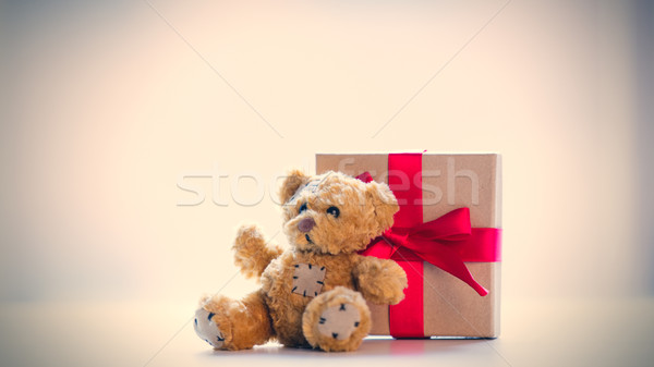 cute teddy bear and beautiful gift on the wonderful white backgr Stock photo © Massonforstock