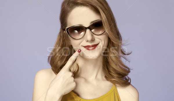 American redhead girl in sunglasses. Photo in 60s style. Stock photo © Massonforstock