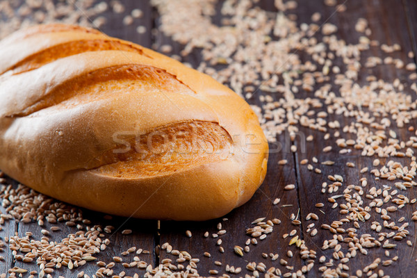 photo of tasty fresh bread loaf on the wonderful brown wooden ba Stock photo © Massonforstock