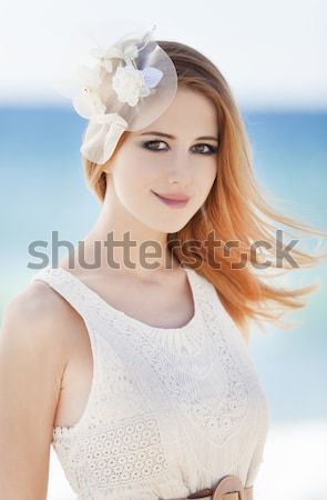 Young bride at the beach with boken at background. Stock photo © Massonforstock