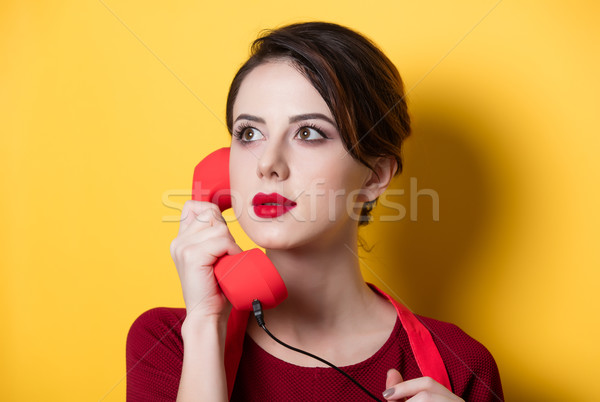 young housewife with red handset  Stock photo © Massonforstock
