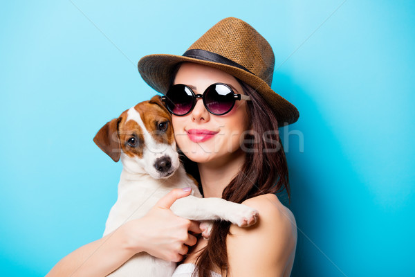 beautiful young woman with her dog standing in front of wonderfu Stock photo © Massonforstock