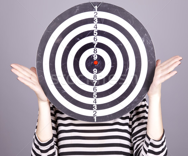 Girl with dartboard in place of head. Stock photo © Massonforstock
