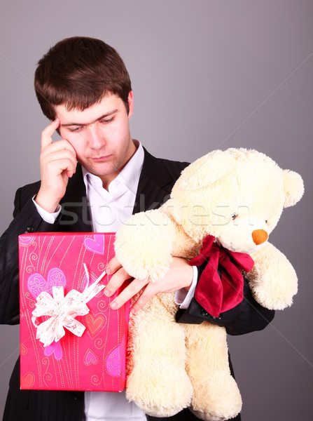 Boy with present box and teddy bear can't select a present in St Stock photo © Massonforstock