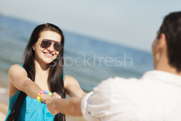 Сток-фото: красивой · пару · пляж · девушки · счастливым · морем