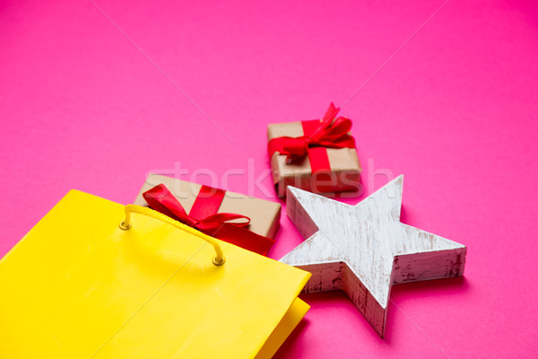Stock photo: cute gifts, star shaped toy and shopping bag on the wonderful pi