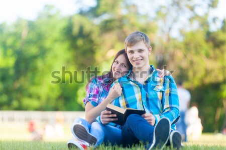 Stock photo: Couple sitting at railway. 