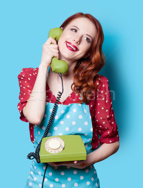 Kız kırmızı elbise yeşil kadran telefon gülen Stok fotoğraf © Massonforstock