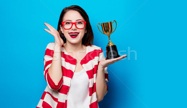 young smiling woman with cup trophy Stock photo © Massonforstock