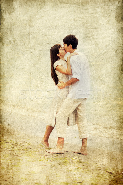 Couple kissing at the beach. Stock photo © Massonforstock