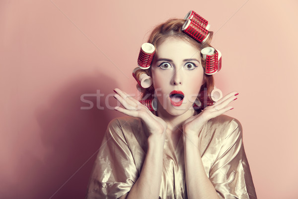 Surprised housewife with curlers Stock photo © Massonforstock