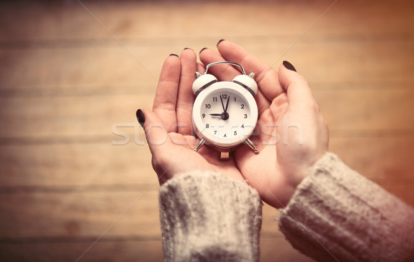 hands holding clock Stock photo © Massonforstock