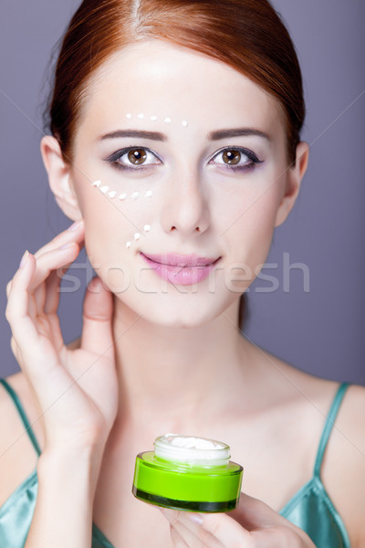photo of beautiful young woman using her cream on the wonderful  Stock photo © Massonforstock