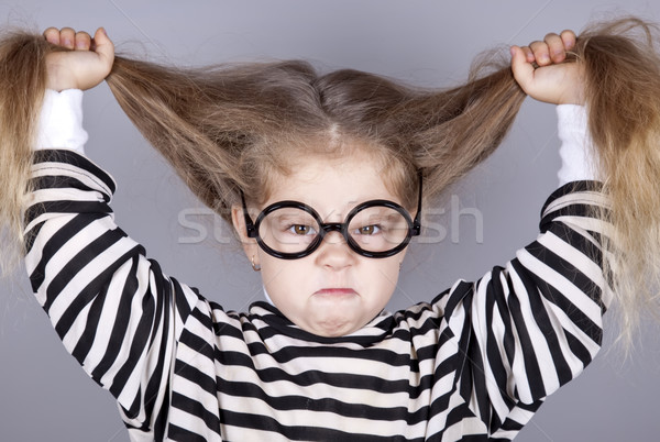 Fiatal kiált gyermek szemüveg csíkos kötött Stock fotó © Massonforstock