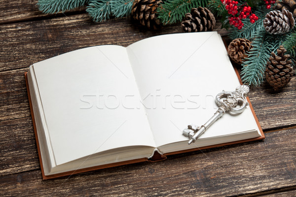 photo of opened notebook and silver key near christmas decoratio Stock photo © Massonforstock