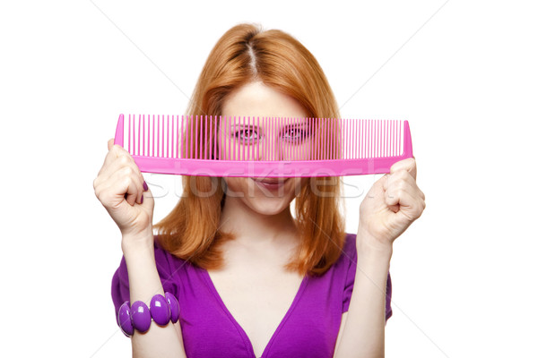 Funny red-haired girl with big comb. Stock photo © Massonforstock