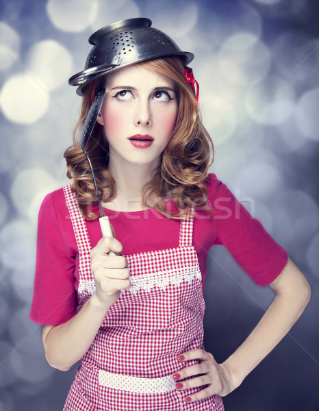 Redhead housewife with soup ladle Stock photo © Massonforstock
