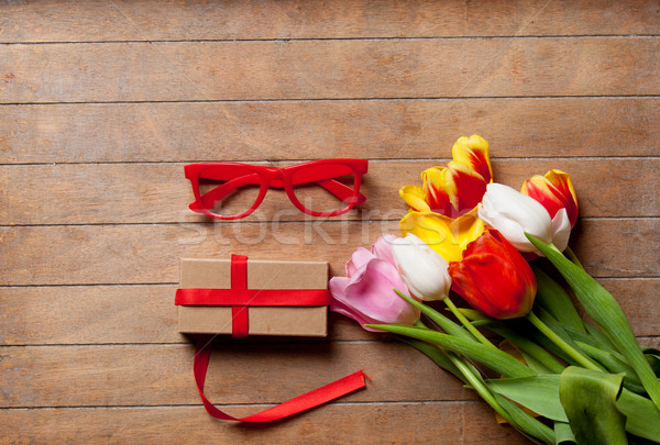 Köteg színes tulipánok ajándék piros szemüveg Stock fotó © Massonforstock