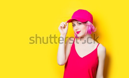 Elegant brunette woman in pink swimsuit and fashion cap. Sexy la Stock photo © Massonforstock