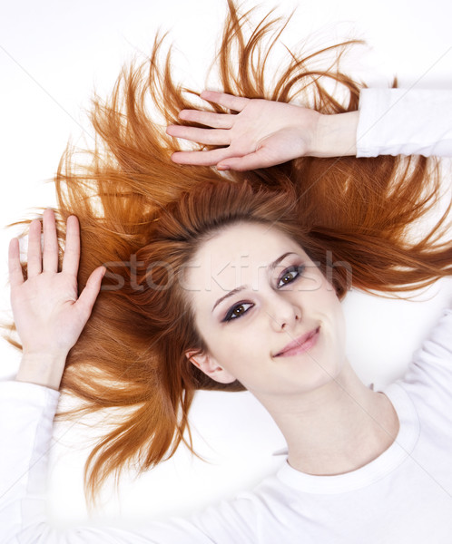 Pretty red-haired sleeping woman in white nightie lying in the b Stock photo © Massonforstock
